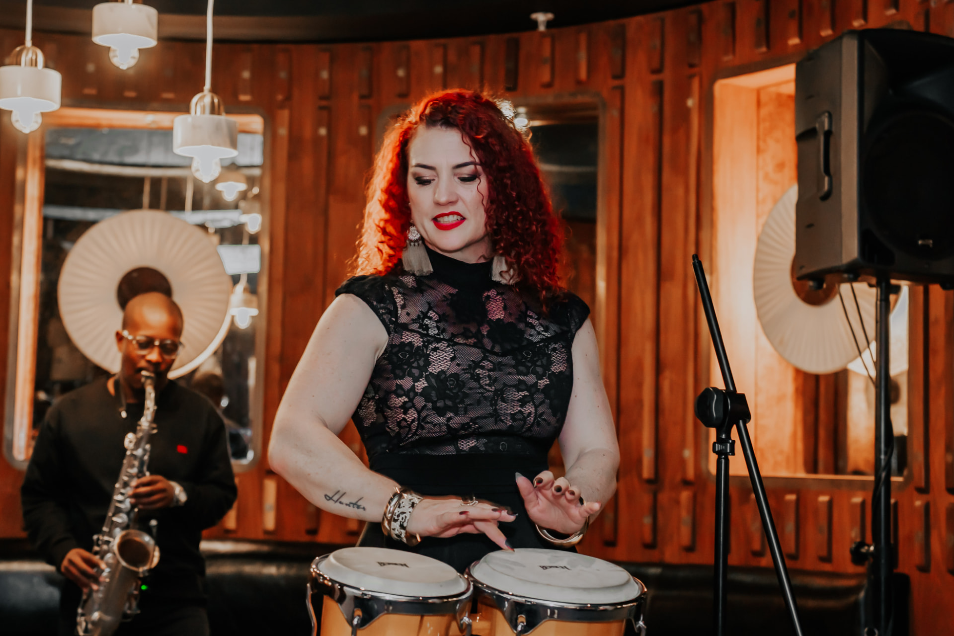 Rene Hunter playing congas with her band
